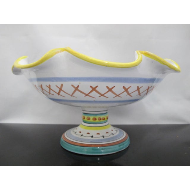 Bright and lovely Italian majolica pottery made in Deruta. Footed fruit bowl with scalloped rim, handcrafted and hand-...