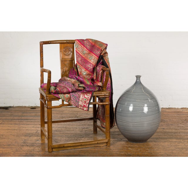 A contemporary Prem Collection artisan hand crafted ceramic vase with narrow mouth, blue grey glaze and striated effects....