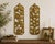 A wonderfully substantial pair of vintage cast-iron botanical wall panels with sculptural openwork branches and an aged...