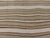 Handwoven in 1956, this vintage Persian Kilim rug is a masterclass in minimalist design and tribal craftsmanship....