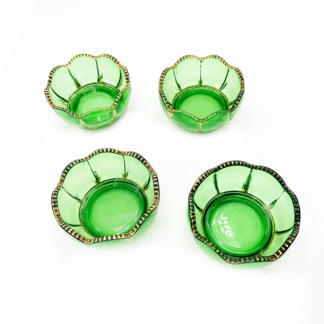 Vintage mid century 4 piece set of Russian green hand blown glass bowls with regal gold, Hollywood Regency detailing. The...