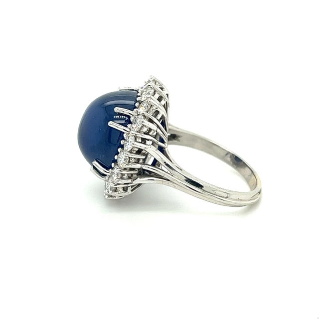 Vintage Art Deco inspired GIA Certified Blue Sapphire and Diamond cocktail ring. Blue Sapphire is or Sri Lanka origin with...