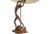 Sculptural tall mid century hand carved teak wood lamp of a dancing female perched on a rocky base with upraised arms and...