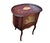This embellished piece with a glass-front door is a vintage French Louis XV style kidney-shaped vitrine-table or a...