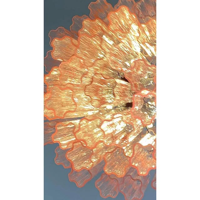 Contemporary pink “tronchi” chandelier murano glass elements.”tronchi”are blown inside a wooden mold, into which the hot...