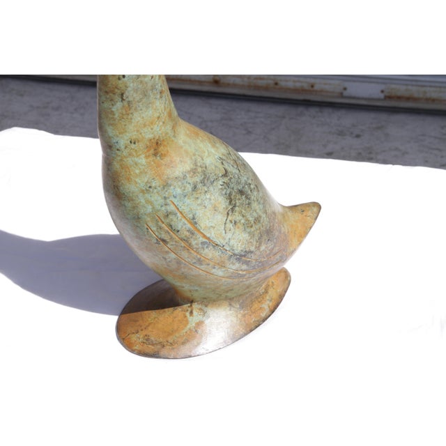 Vintage Hollywood Regency bronze swan. Lightly polished to bring out the shine of the bronze without taking away the...