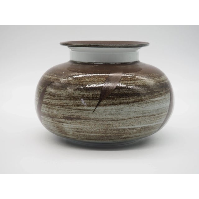 A very nice swedish nordic design solid vase in porcelain that easily blends into the home with its pleasant tones of...