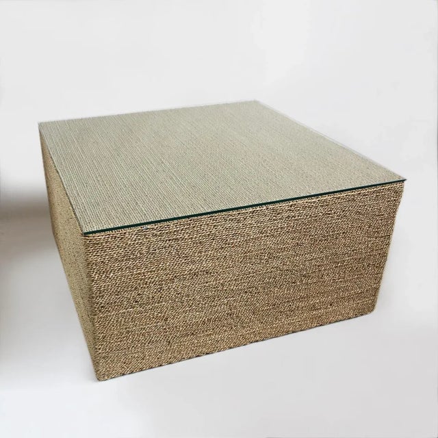 Square seagrass coffee table. Wood frame with seagrass woven top and sides. Glass top. Recommended for under cover use...