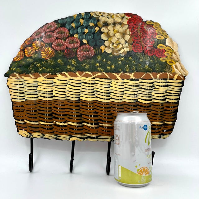 Vintage Tole Metal Handpainted Floral Nantucket Basket Wall Hanging with Hooks. Elevate your decor with this delightful...
