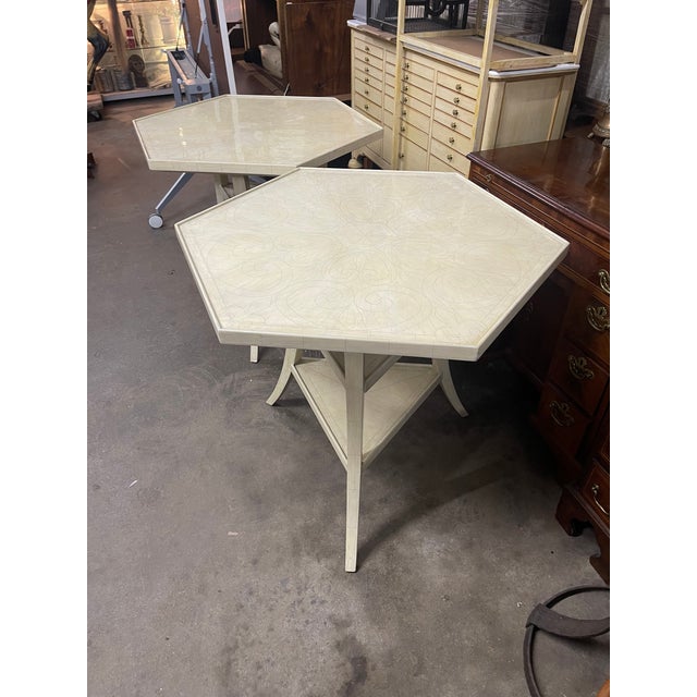 An exquisite pair of superb condition Dennis & Leen Lambert hexagonal side tables in a faux ivory finish with a subtle...