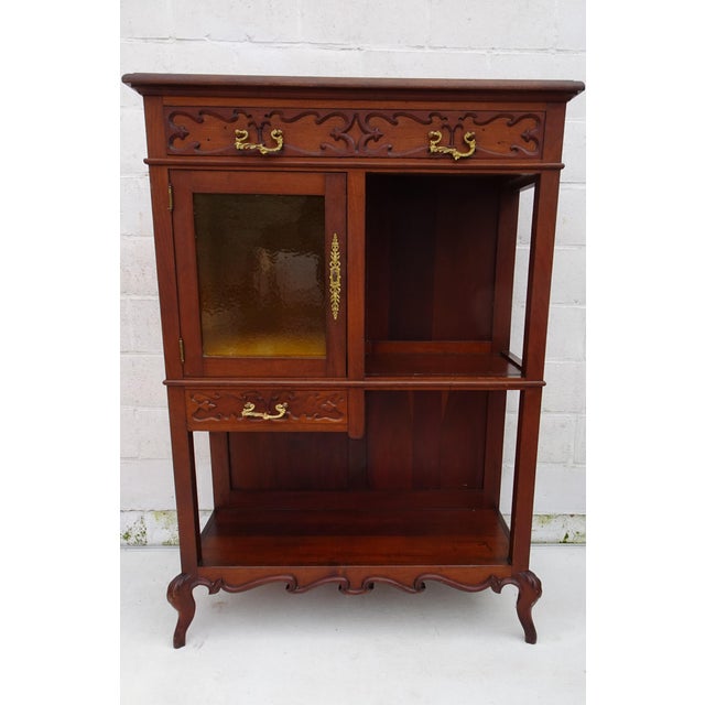 The small shelves inside were added later. The exterior surfaces are scratched and have had a layer of varnish. There are...