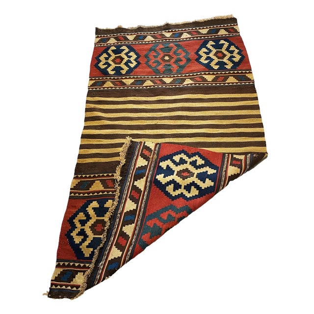 This Antique and Rare Tribal Caucasian Kuba Kilim stands at 5'92" by 3'08" (71" h by 37" w) and dates back to the late...