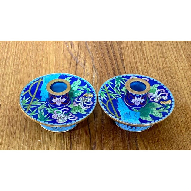 Luscious Chinese bright blue cloisonné candle holders from the 1970s-80s. Solid brass with wonderful floral and leaf...