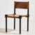Brutalist beech and leather chair from the 1970s. The leather-covered surface and black-lacquered beech frame show...