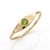 Inspired by organic forms and classic talismans, this slender signet ring showcases a vibrant 3mm Peridot gemstone set...