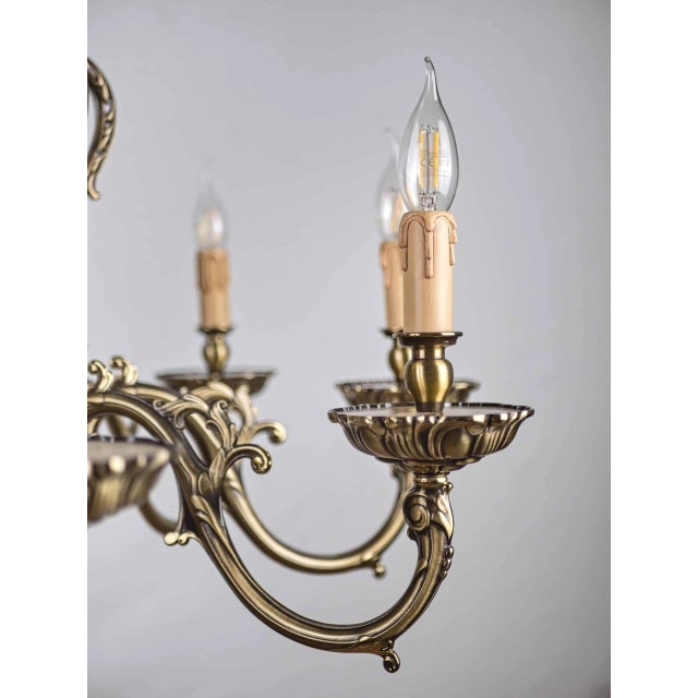 Top quality made of solid brass with floral decoration. Eight-armed chandelier from the spanish manufacturer of luxury...