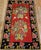 A vibrant and evocative vintage Karabagh rug from the Armenian village weavers of the Caucasus Mountains, this early 20th...