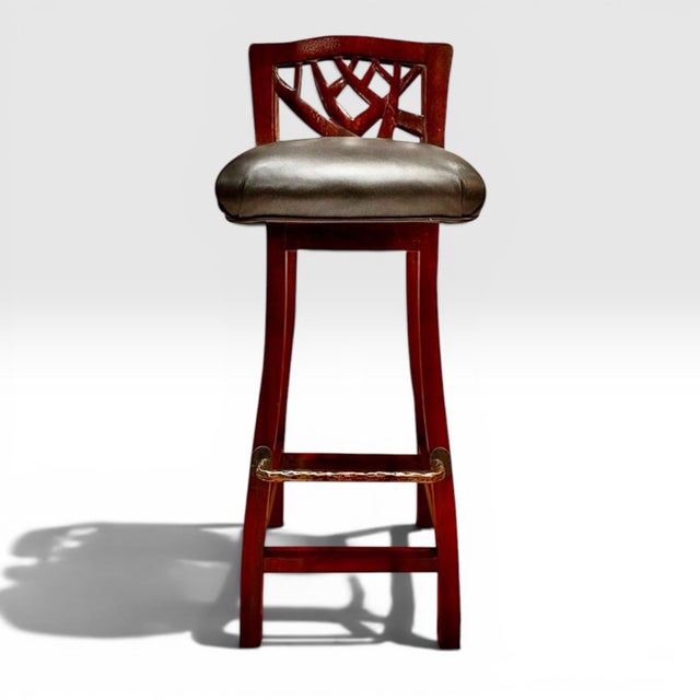 A set of bar stools from designer Martin Pierce. Hand-carved walnut with black full-grain leather seats and hand-hammered...