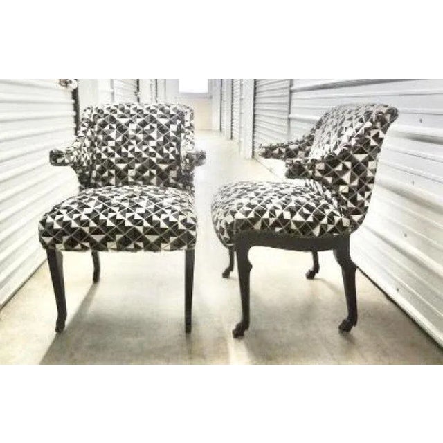 Stunning pair of mid-century James Mont inspired ebonized chairs with hoof feet. These unique armchairs have been...