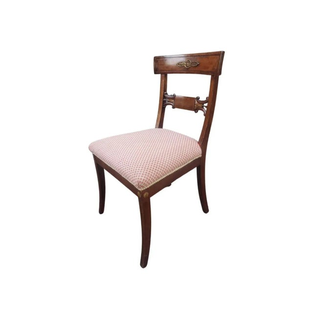 A 19th Century Empire Ormolu Mounted, Partial Gilt Mahogany and Upholstered side Chair. Measure 19" in width, 19" in depth...