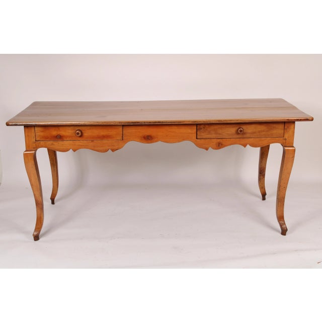 Louis XV style fruit wood writing / dining table, made from 19th century and later elements. With a 4 board rectangular...