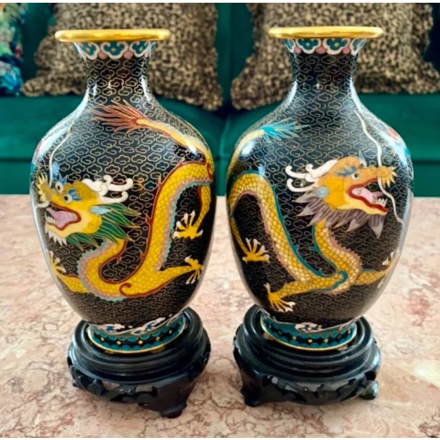 Pair of Chinese Cloisonné Dragon Vases on Wooden Stands in excellent condition. Small holes occur in Cloisonné enamel with...
