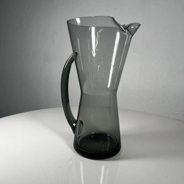 For your consideration, a set which includes a glass martini pitcher & four (4) glasses attributed to Morgantown WV...