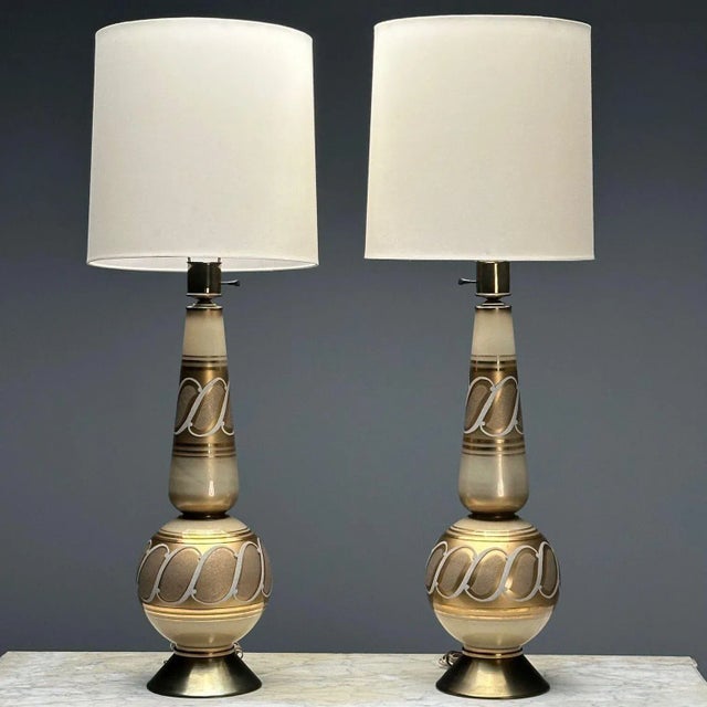 Italian Mid-Century Modern, Large Table Lamps, Gold Glass, Brass, Italy, 1960s A pair of large glass table lamps designed...