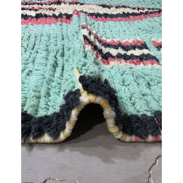 Contemporary Moroccan Rug | Handwoven Berber Wool Rug with Turquoise Field and Playful Pictorial Motifs This charming...