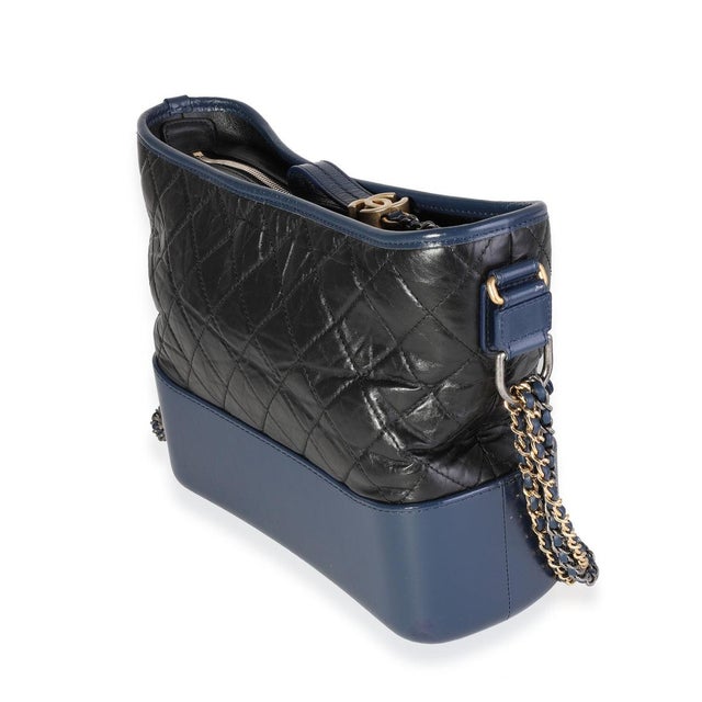 Item #: 119004 Interior Material: Fabric Size: Large Features Interior: One zip pocket. Two slip pockets. Dimensions: 11 x...