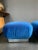 Original pair of Karl Springer Souffle ottomans/poufs on casters for easy moving. Polished steel base and blue velvet...