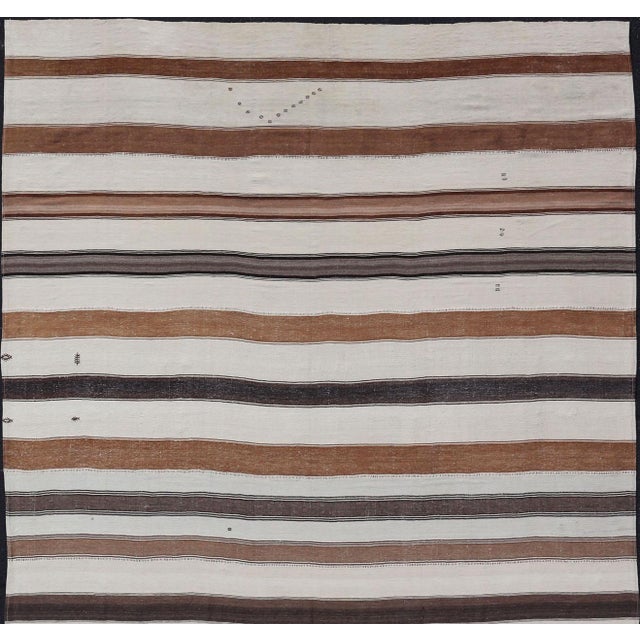 Measures: 11'0 x 18'1 Large Vintage Turkish Kilim with Vertical Stripes in Tan, Taupe, Cream and Brown. Keivan Woven Arts...