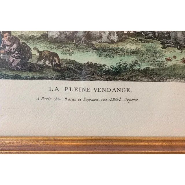 This vintage print "La Pleine Vendange" or The Full Harvest is hand watercolored and depicts the harvesting of grapes in...