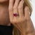 This extraordinary French Mid Century ring is centered by a Gübelin-certified cushion brilliant cut ruby weighing 3.55...