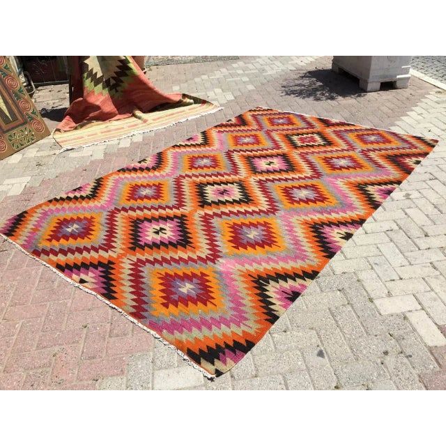 This beautiful, vintage, handwoven kilim is approximately 60 years old. It is handmade, of very fine quality hand spun...