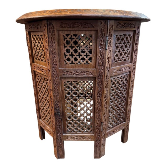 Beautiful antique Turkish tea table. It has a round top with a carved floral border with a wire/dot inlay in a stylized...