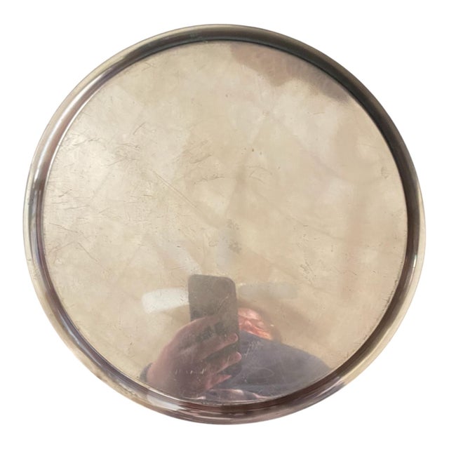 Vintage midcentury modern copper serving tray featuring an etched floral design. 11" in diameter. Some wear/patina...