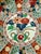 A stunning example of Japanese Imari porcelain, this large scalloped-edge charger is a feast for the eyes. The hand-...