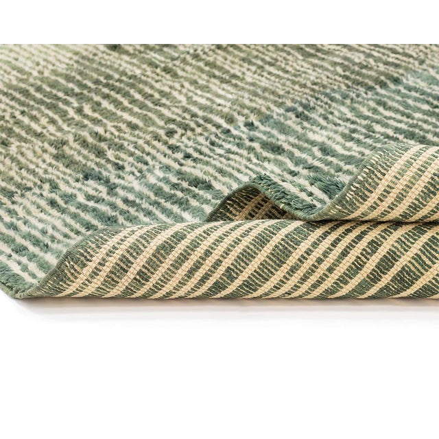 This 337 x 269 cm hand-knotted wool rug is a refined expression of contemporary Moroccan craftsmanship, featuring fluid...