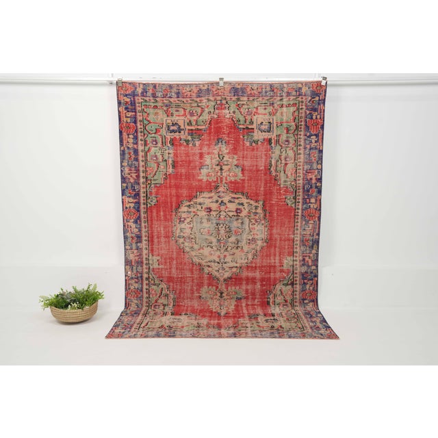 Vintage Hand-Knotted runner rug is a semi-antique vintage area rug. The '70s Eastern region of Anatolia's unique rug is...