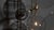 An array of ethereal glass globes floats weightlessly around a right-angled geometric lattice. The mouth-blown spheres are...