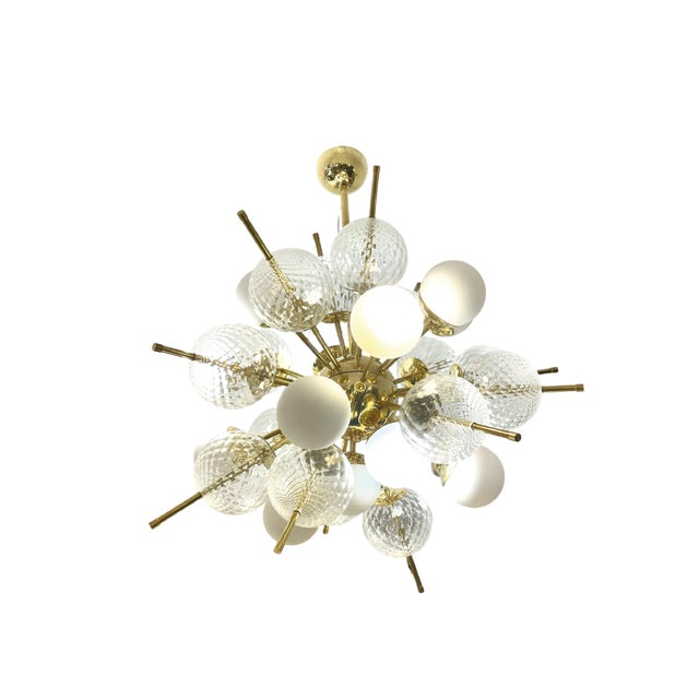 Spectacular Sputnik-style lamp made of hand-blown Murano glass spheres. It combines classic spheres in an elegant matte...