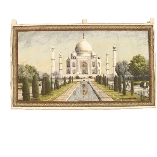 Flemish wall tapestry was woven on a large scale from wool with muted earth tones into a lavish landscape composition that...