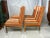 Introducing a fantastic set of four vintage Parsons dining chairs that exude both style and quality. These chairs are not...