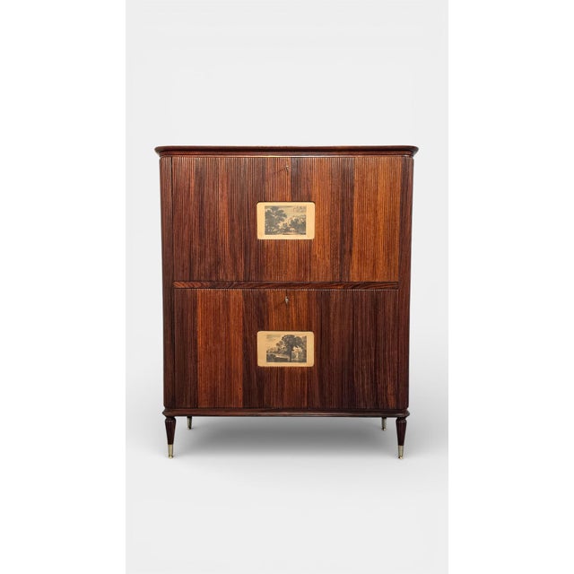 Beautiful Italian Mid Century Cabinet Bar of great executive quality, the upper top is made of veneererd wood with a maple...