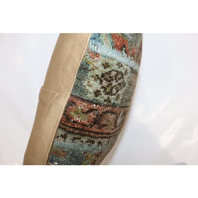 Pillow made from an antique persian mahal rug made into a patchwork format