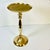 We love this brass drinks table. It has a raised-edge brass top that has a cork liner on top so iced drinks stay in place....