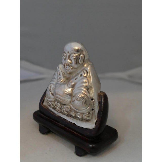 This unusual vintage sterling silver Chinese buddha miniature with a protruding belly dates from the 1920’s. He is...
