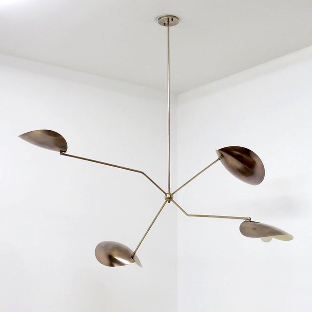 wonderful aged Calder™ Brass Chandelier by Gallery L7, handcrafted and finished in Los Angeles from American brass, with...