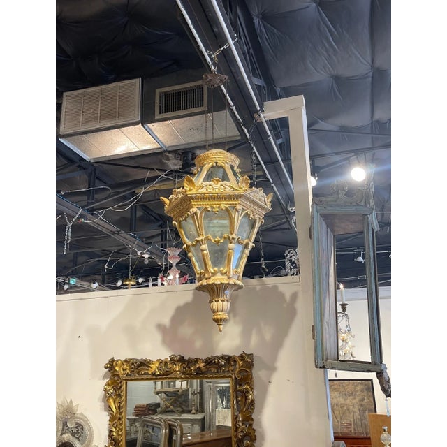 Elegant 19th century Italian carved and giltwood lantern. Amazing craftsmanship on this piece. Makes a beautiful statement...